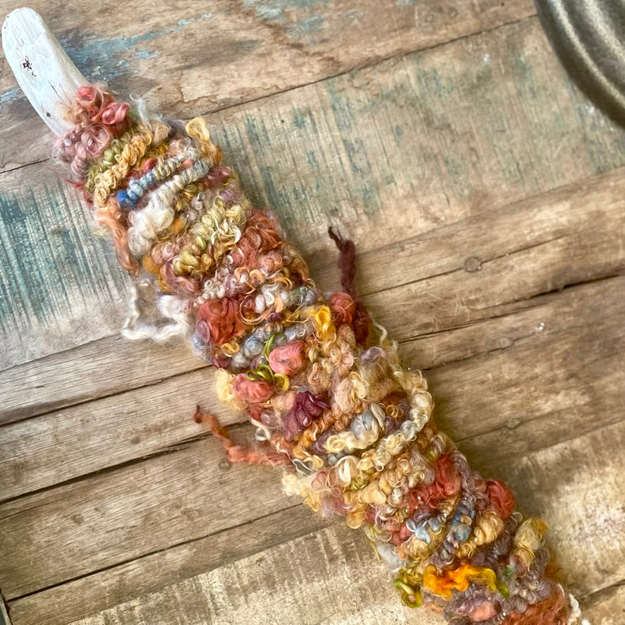 Drift Bloom Hand Dyed, Hand Spun Core Spun Art Yarn on Oregon Coast Driftwood