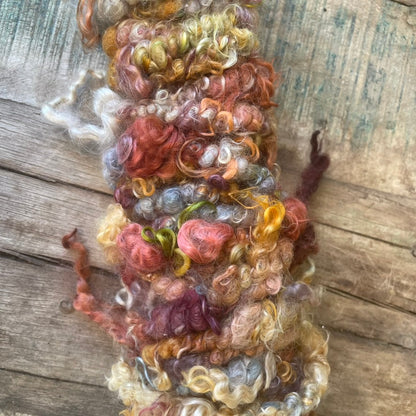 Drift Bloom Hand Dyed, Hand Spun Core Spun Art Yarn on Oregon Coast Driftwood